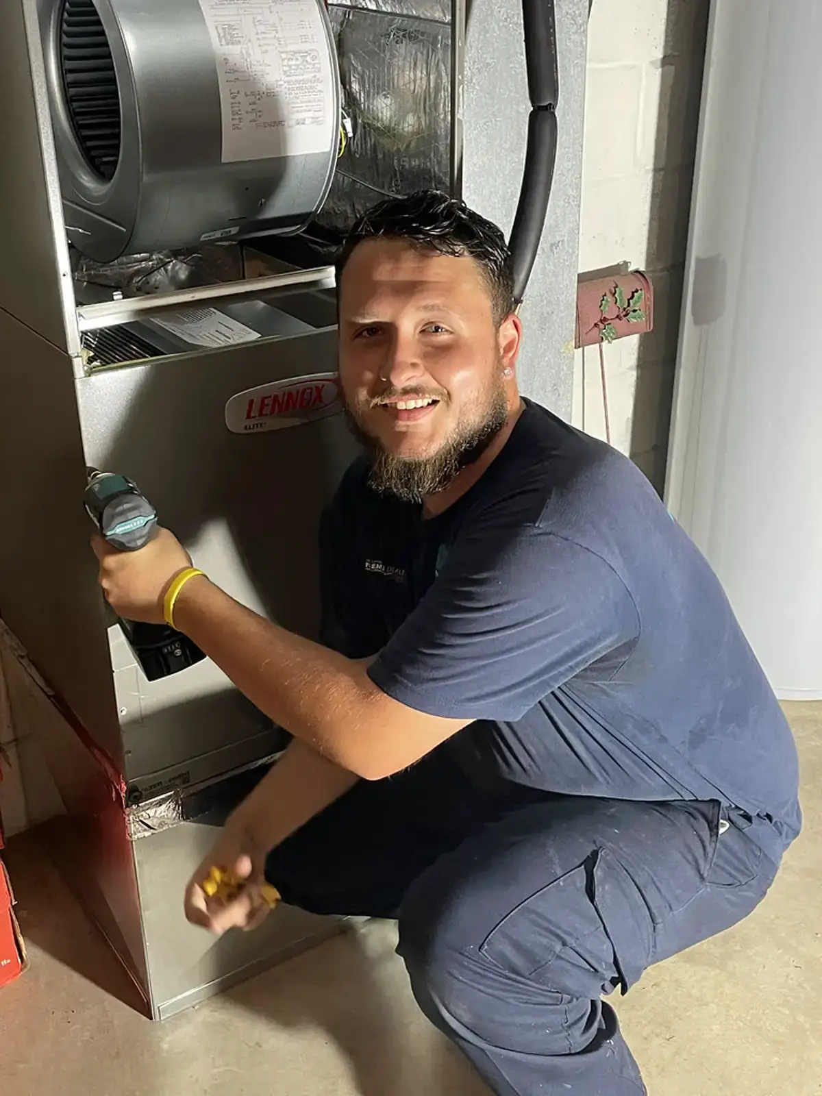 HVAC technician installing a residential air handler unit